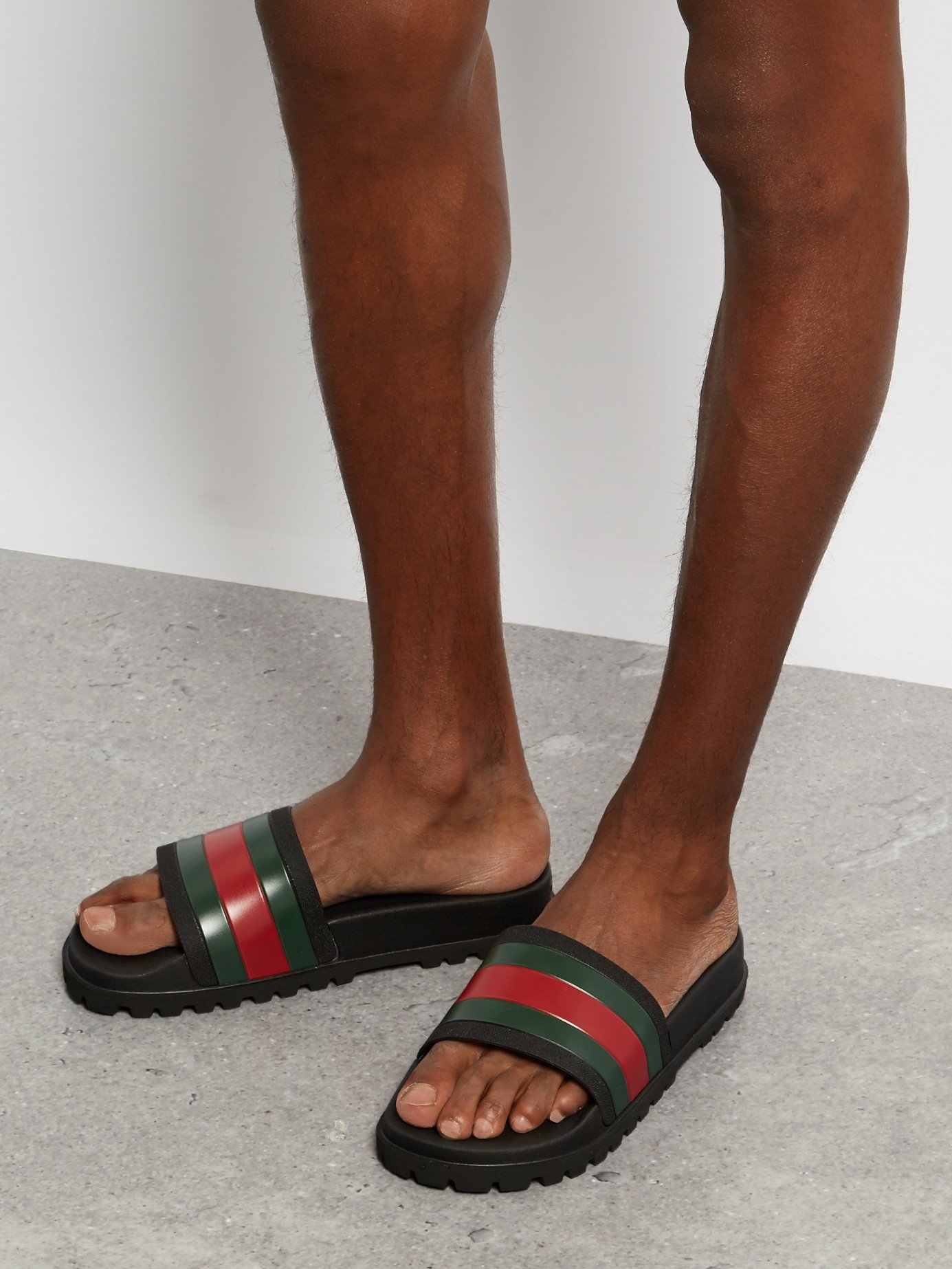 Gucci slides on feet online